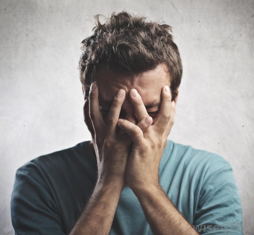 guy-covering-his-face